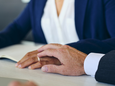 man inappropriately touching married woman's hand in the office